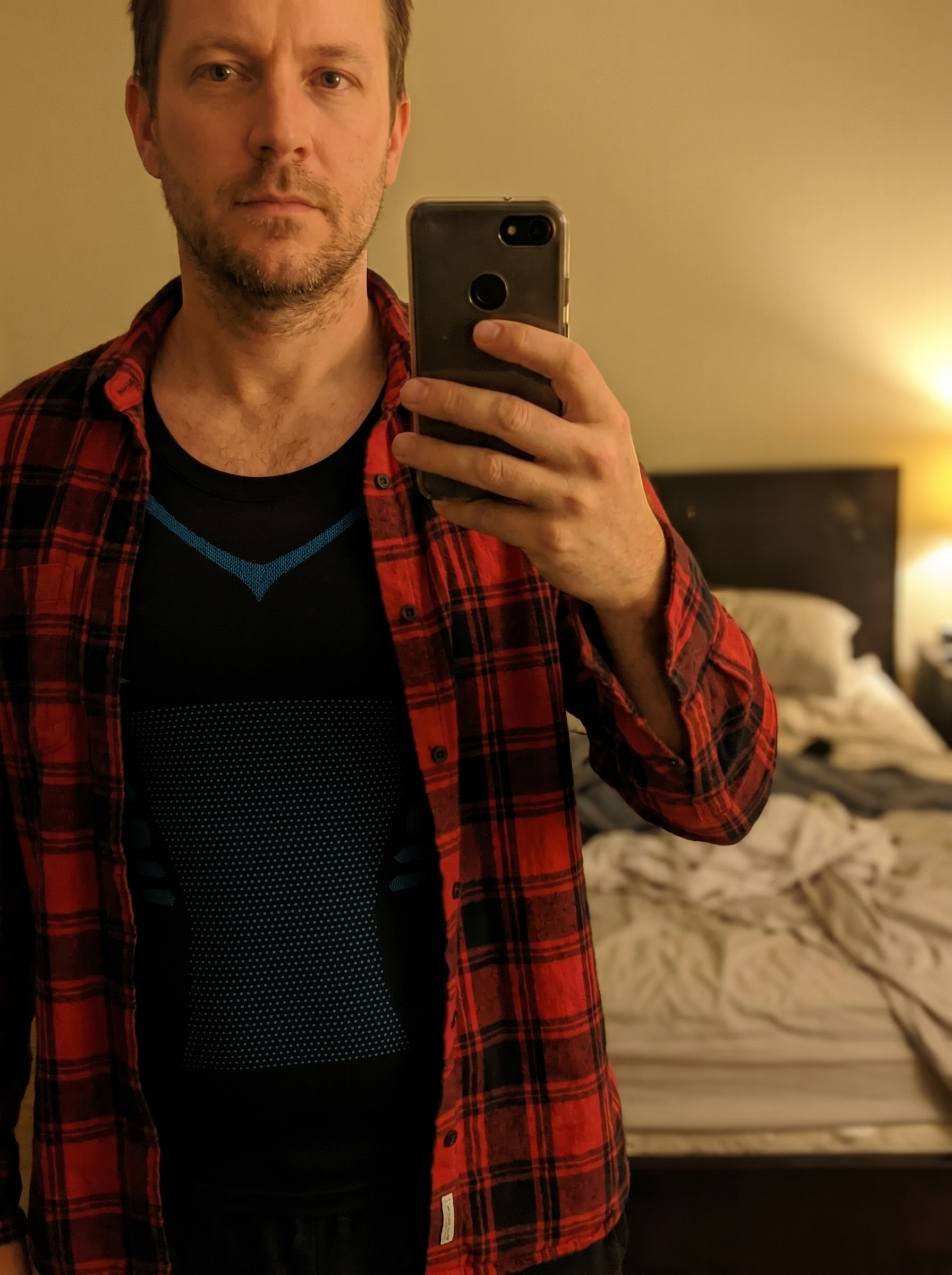 Verified customer wearing the Veilor compression tank under an open shirt